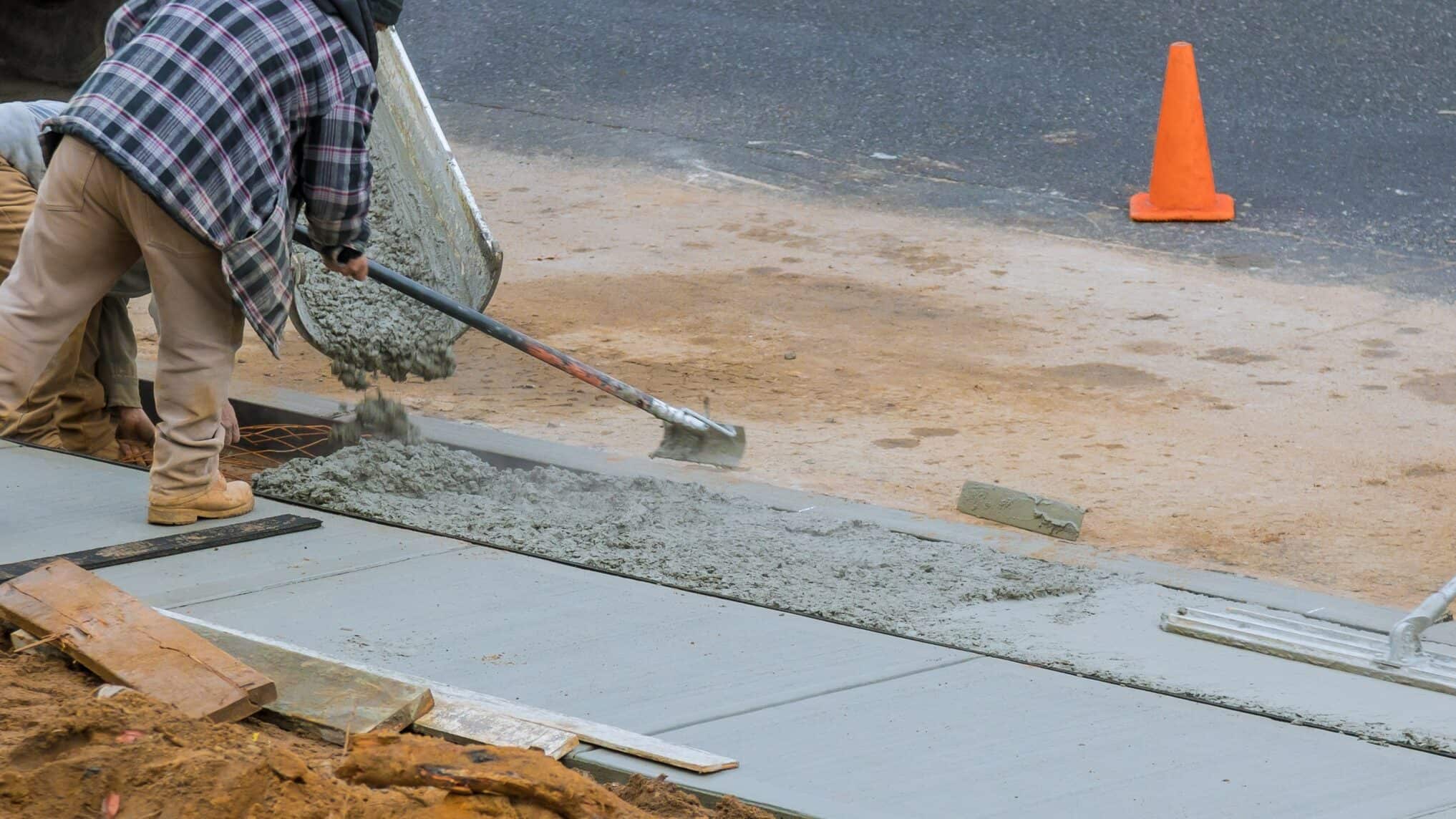 Concrete sidewalk being poured in the cold