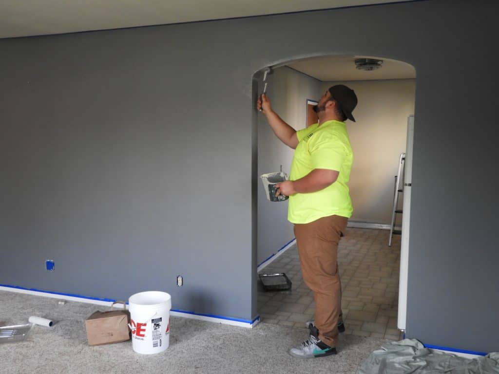 Stock image - guy painting house