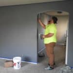 Stock image - guy painting house