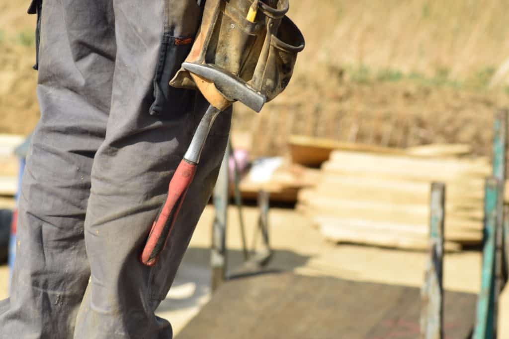 Worker wearing tool belt