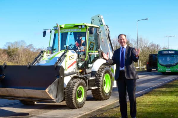 Technology and Decarbonisation Minister Jesse Norman pictured in Rocester, Staffordshire with a JCB backhoe loader powered by a hydrogen combustion engine