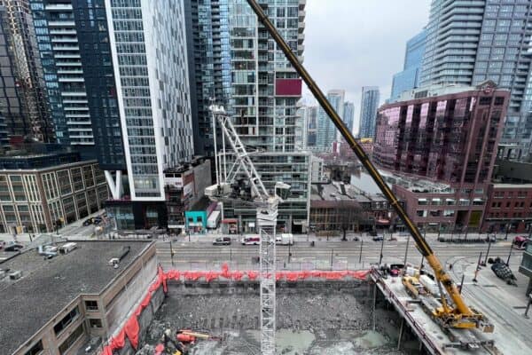 Crane Goes Up at 400 King West With Excavation Complete