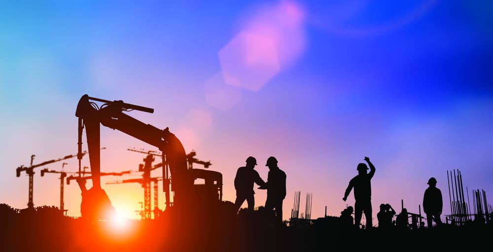 Silhouette of engineer and construction team working at site.
