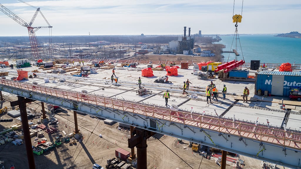 Towers almost complete as Gordie Howe bridge spans begin to cross river