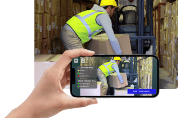 A man in a construction outfit picks up a box.